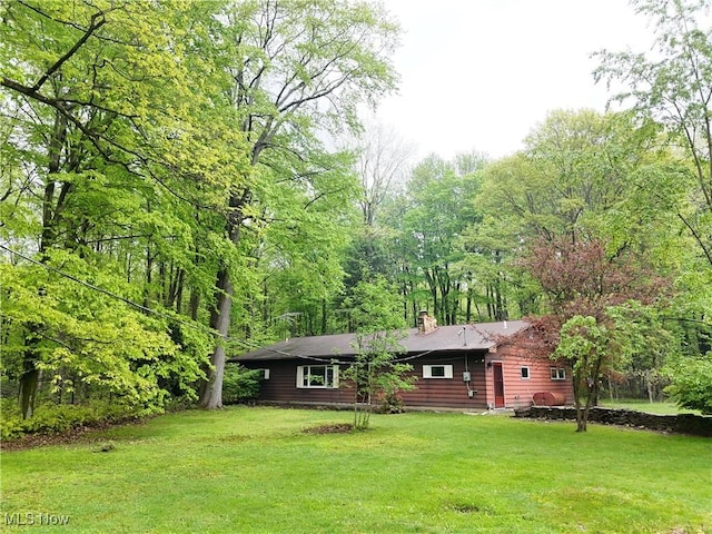 8758 Ward N Rd, Kinsman, OH 44428 - view of front facade featuring a chimney and a front lawn