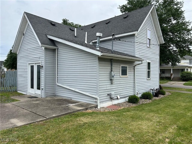 201 E St, Caldwell, OH 43724 - view of side of property with a shingled roof and a patio