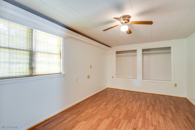 10311 Myers Rd, Kensington, OH 44427 - unfurnished bedroom featuring light wood finished floors, baseboards, and ceiling fan