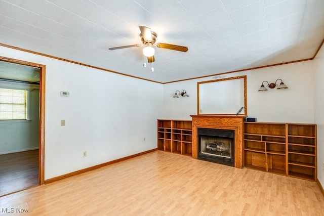 10311 Myers Rd, Kensington, OH 44427 - unfurnished living room featuring wood finished floors, a ceiling fan, ornamental molding, a fireplace, and baseboards