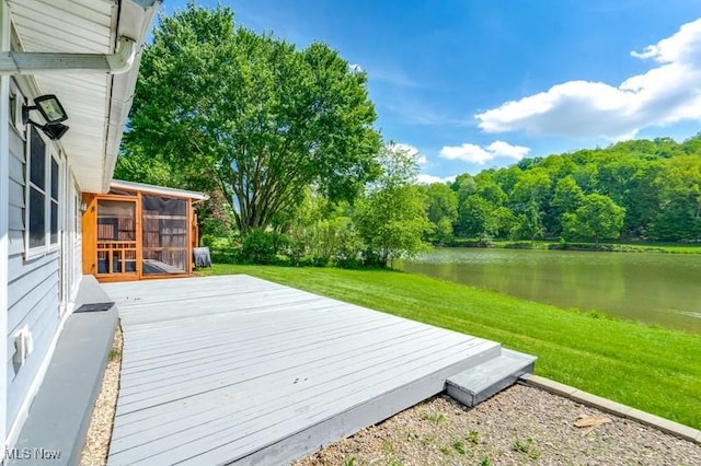 10311 Myers Rd, Kensington, OH 44427 - wooden deck featuring a sunroom, a water view, a lawn, and a wooded view