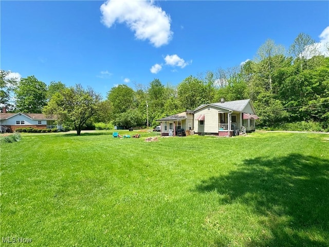 78 Findley St, Dillonvale, OH 43917 - view of grassy yard featuring view of wooded area