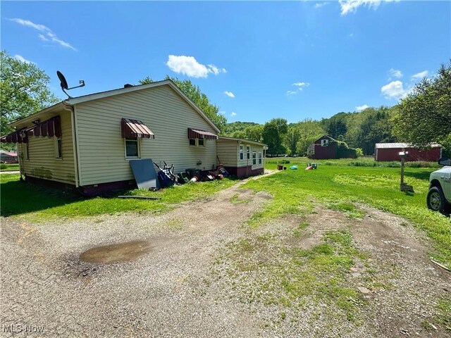78 Findley St, Dillonvale, OH 43917 - view of home's exterior with dirt driveway and a yard