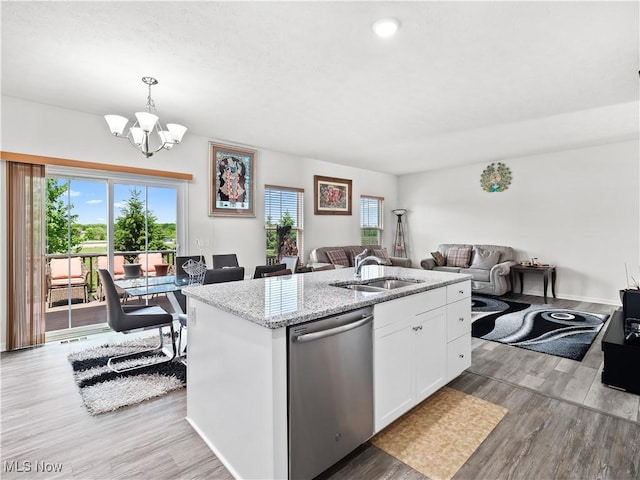 3243 Broadleaf Way, Brunswick, OH 44212 - kitchen featuring stainless steel dishwasher, a sink, open floor plan, white cabinets, and light wood-style flooring