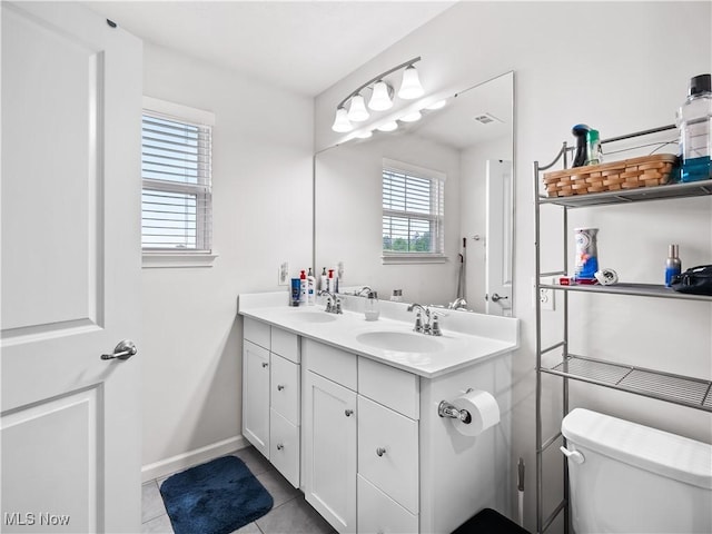 3243 Broadleaf Way, Brunswick, OH 44212 - bathroom featuring toilet, tile patterned floors, double vanity, and baseboards
