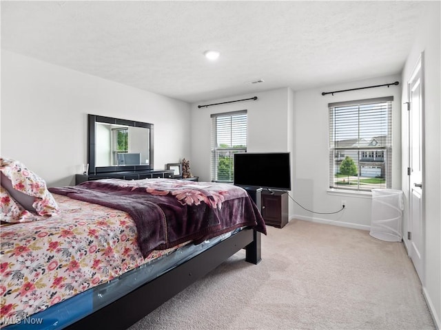3243 Broadleaf Way, Brunswick, OH 44212 - bedroom with light carpet, baseboards, and a textured ceiling