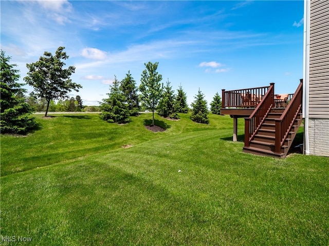 3243 Broadleaf Way, Brunswick, OH 44212 - view of grassy yard featuring a deck and stairway