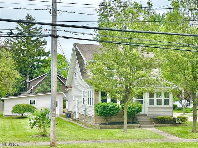 177 N Cleveland Ave, Mogadore, OH 44260 - view of front of property with a front yard, entry steps, and a shingled roof