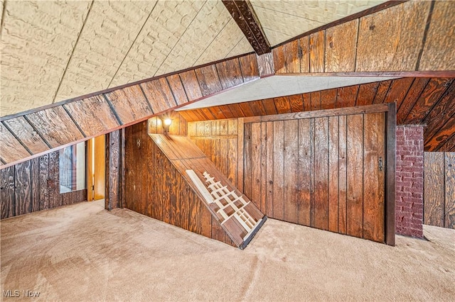131 E 206th St, Euclid, OH 44123 - staircase with carpet flooring, wooden walls, and lofted ceiling