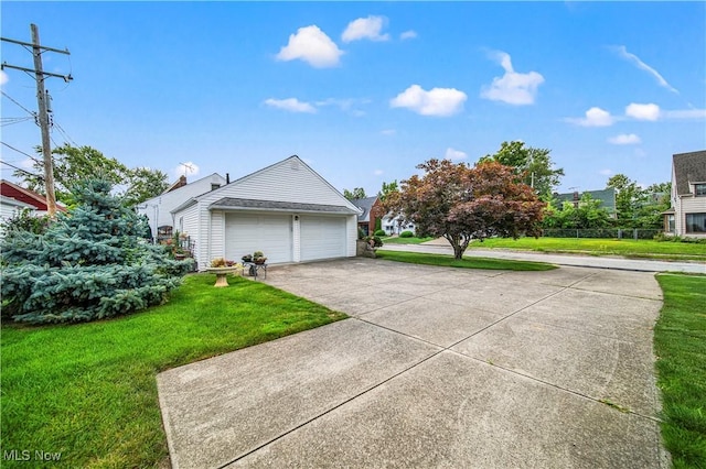 131 E 206th St, Euclid, OH 44123 - view of side of home with a garage and a lawn