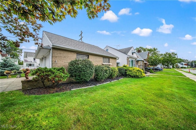 131 E 206th St, Euclid, OH 44123 - view of home's exterior featuring a yard