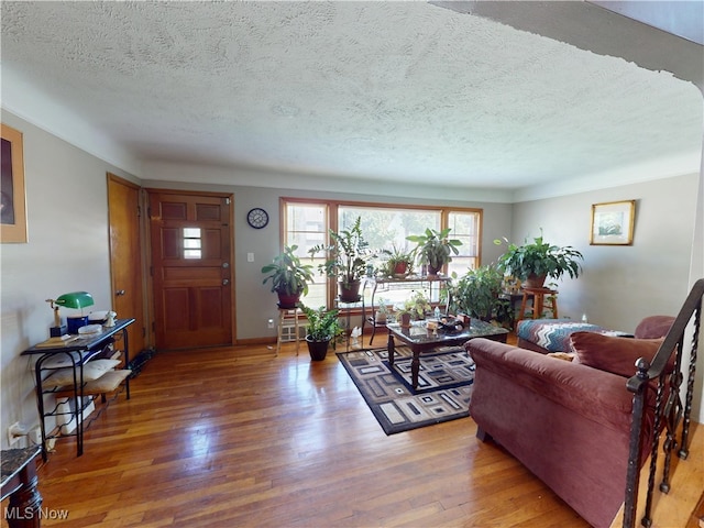3882 Wallingford Rd, South Euclid, OH 44121 - living area featuring wood finished floors and a textured ceiling