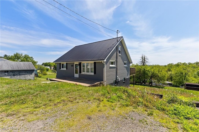 60620 Main St, Jacobsburg, OH 43933 - rear view of house with metal roof