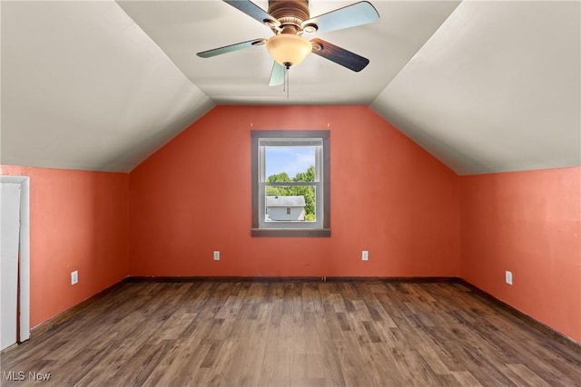 60620 Main St, Jacobsburg, OH 43933 - additional living space featuring wood finished floors, vaulted ceiling, a ceiling fan, and baseboards