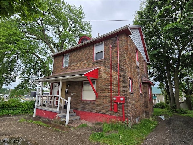 958 E Wilbeth Rd, Akron, OH 44306 - view of front of home with brick siding and a porch