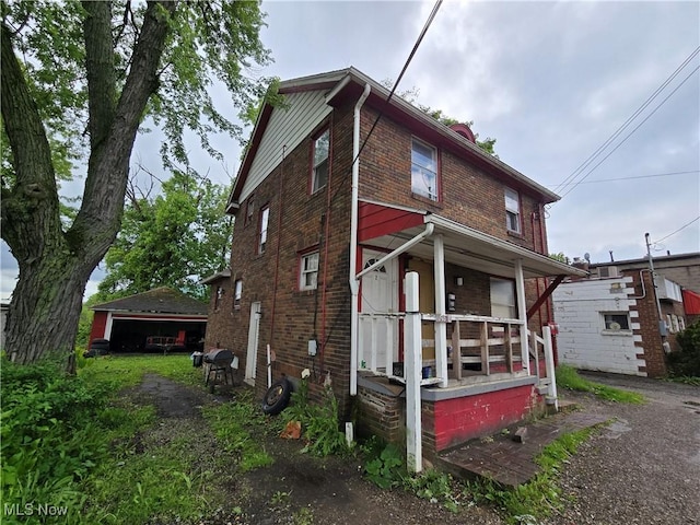 958 E Wilbeth Rd, Akron, OH 44306 - view of side of property with brick siding and a porch