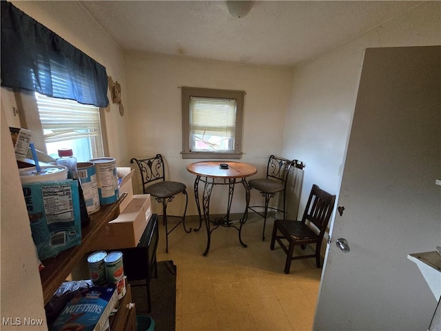 958 E Wilbeth Rd, Akron, OH 44306 - dining room with healthy amount of natural light and tile patterned floors