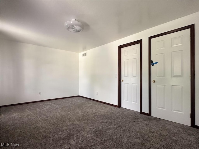 95 Cheyenne Dr, Girard, OH 44420 - empty room with dark colored carpet and baseboards