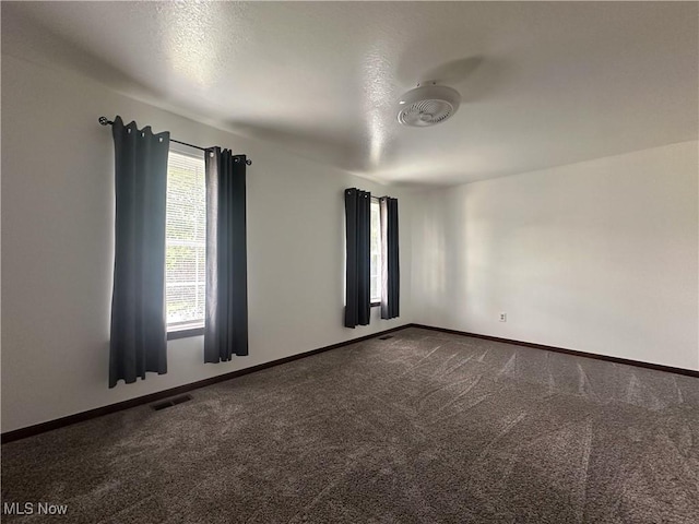 95 Cheyenne Dr, Girard, OH 44420 - empty room with dark colored carpet and baseboards