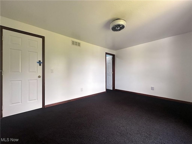 95 Cheyenne Dr, Girard, OH 44420 - empty room with dark carpet and baseboards