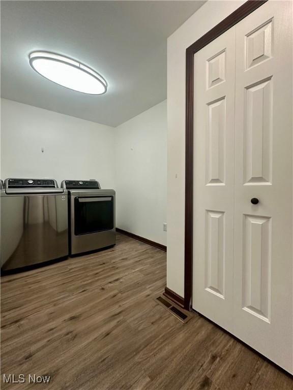 95 Cheyenne Dr, Girard, OH 44420 - kitchen featuring independent washer and dryer and wood finished floors