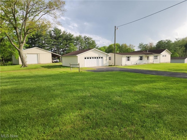 5747 E Clinton St, Albany, OH 45710 - view of grassy yard featuring a garage