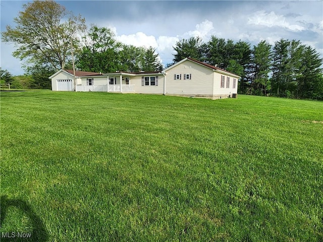 5747 E Clinton St, Albany, OH 45710 - rear view of property with a lawn