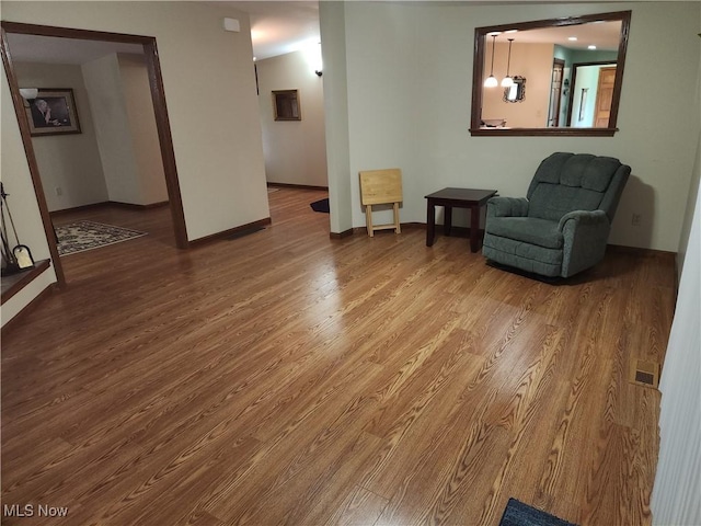 5747 E Clinton St, Albany, OH 45710 - sitting room featuring wood finished floors and baseboards