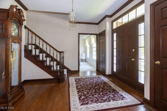 681 Tamarac Trl, Wadsworth, OH 44281 - foyer with crown molding, plenty of natural light, wood finished floors, and baseboards