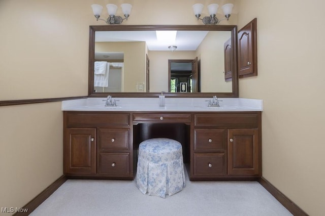 681 Tamarac Trl, Wadsworth, OH 44281 - bathroom featuring double vanity, a chandelier, baseboards, and carpet floors