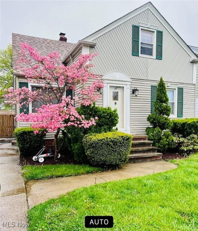7506 Renwood Dr, Parma, OH 44129 - view of front of house featuring a chimney
