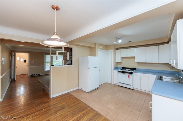 14245 Cedar Rd, South Euclid, OH 44121 - kitchen with white appliances, a sink, baseboards, white cabinets, and hanging light fixtures