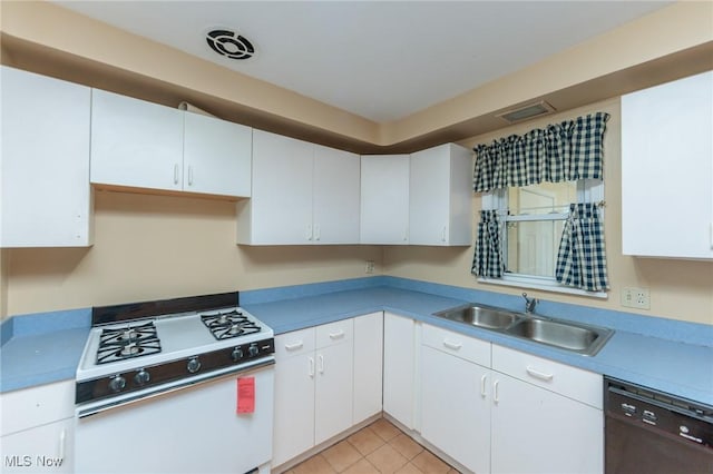 14245 Cedar Rd, South Euclid, OH 44121 - kitchen featuring white gas range, black dishwasher, a sink, white cabinets, and light countertops