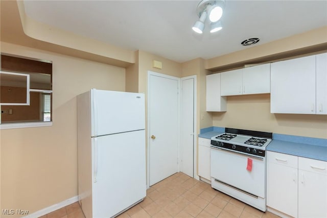 14245 Cedar Rd, South Euclid, OH 44121 - kitchen featuring white appliances, white cabinets, and light tile patterned floors