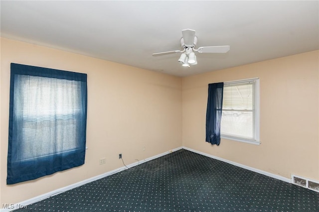 14245 Cedar Rd, South Euclid, OH 44121 - carpeted empty room with baseboards and ceiling fan