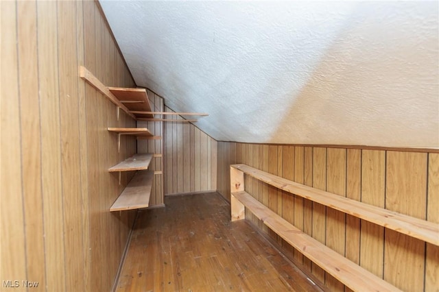 14245 Cedar Rd, South Euclid, OH 44121 - walk in closet with lofted ceiling and dark wood finished floors