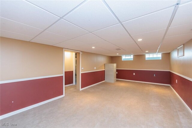 14245 Cedar Rd, South Euclid, OH 44121 - basement featuring carpet, baseboards, and a drop ceiling