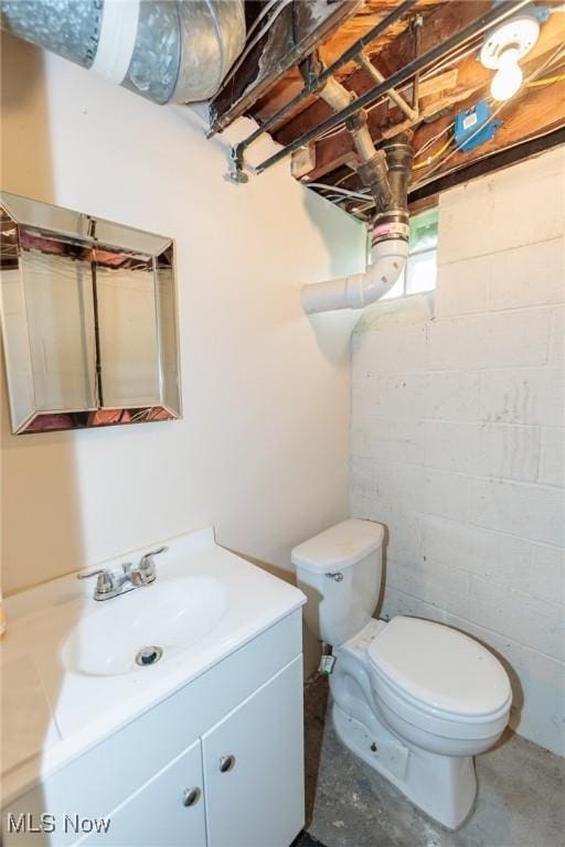 14245 Cedar Rd, South Euclid, OH 44121 - bathroom featuring toilet, vanity, and concrete floors