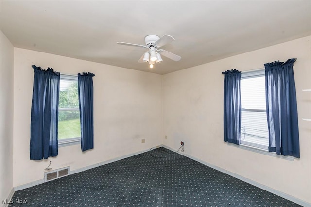 14245 Cedar Rd, South Euclid, OH 44121 - carpeted spare room with ceiling fan and baseboards