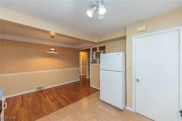 14245 Cedar Rd, South Euclid, OH 44121 - kitchen featuring freestanding refrigerator, light wood-style floors, and baseboards