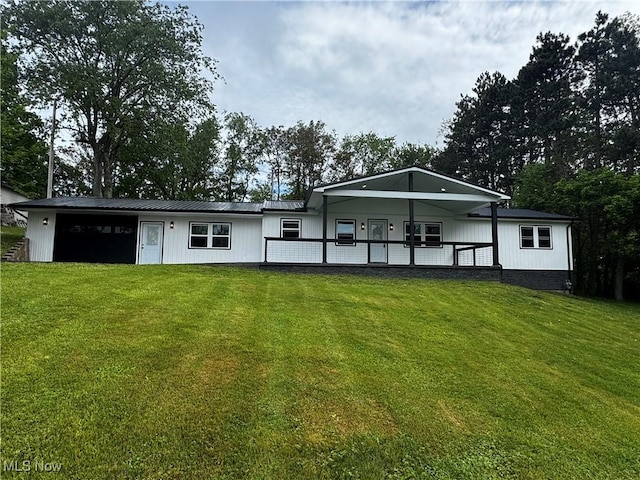 47423 Centerville Jacobsburg Rd, Jacobsburg, OH 43933 - back of property with a lawn and metal roof