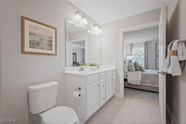 149 Hidden Village Dr Unit S/L 152, Perry, OH 44081 - ensuite bathroom with toilet, double vanity, tile patterned flooring, and baseboards