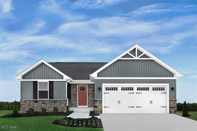 149 Hidden Village Dr Unit S/L 152, Perry, OH 44081 - craftsman-style house with board and batten siding, stone siding, concrete driveway, an attached garage, and a front lawn