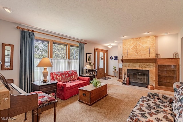 12075 State Route 700, Hiram, OH 44234 - living area featuring carpet flooring, a textured ceiling, and a large fireplace