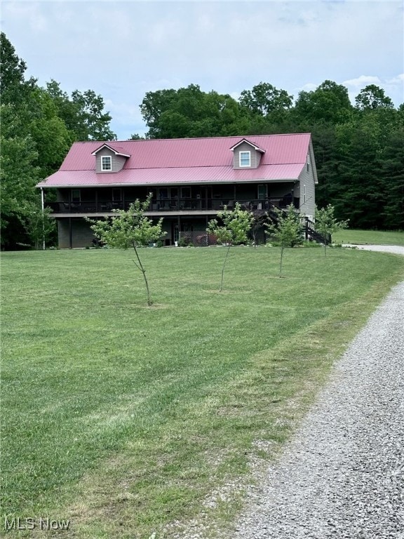 10664 W Little Kanawha Hwy, Mount Zion, WV 26151 - view of front of home with a front lawn, driveway, and metal roof