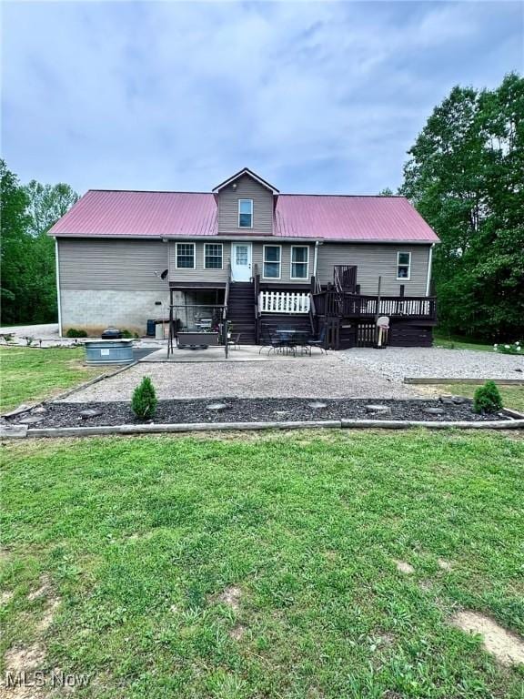 10664 W Little Kanawha Hwy, Mount Zion, WV 26151 - rear view of house featuring a yard, a deck, and metal roof