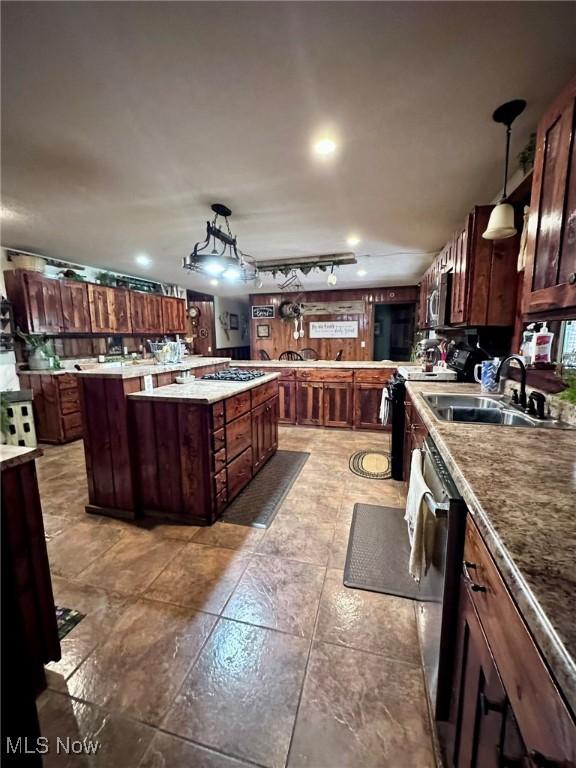 10664 W Little Kanawha Hwy, Mount Zion, WV 26151 - kitchen with a sink, appliances with stainless steel finishes, a center island, hanging light fixtures, and tile patterned floors