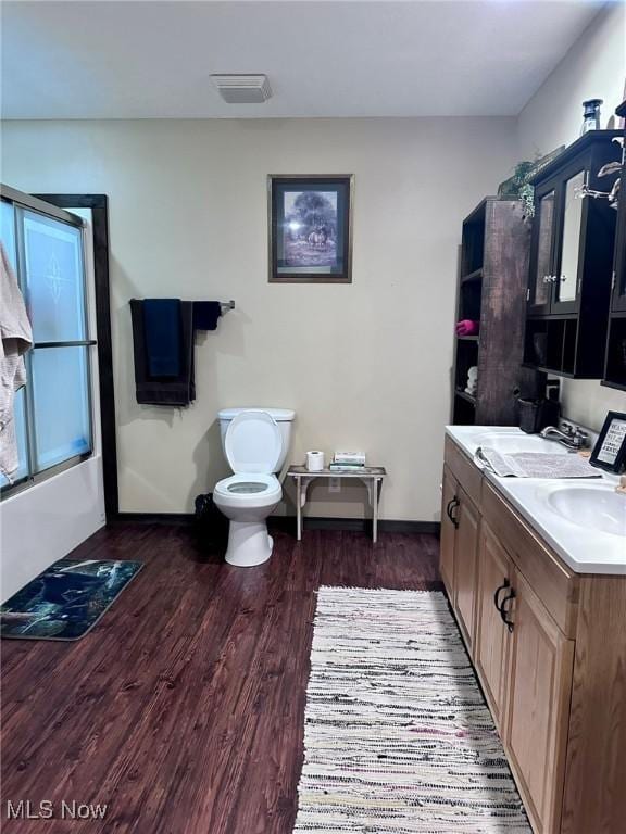10664 W Little Kanawha Hwy, Mount Zion, WV 26151 - bathroom featuring toilet, wood finished floors, baseboards, and vanity
