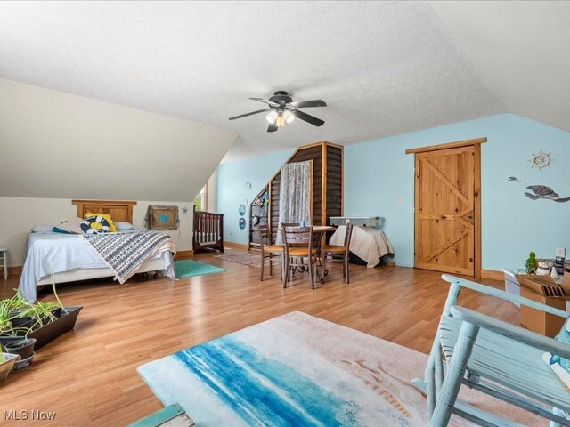 10664 W Little Kanawha Hwy, Mount Zion, WV 26151 - bedroom with vaulted ceiling, wood finished floors, ceiling fan, and baseboards