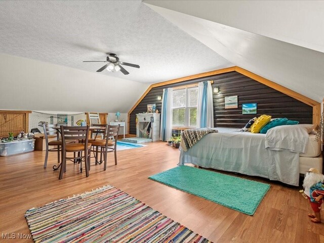 10664 W Little Kanawha Hwy, Mount Zion, WV 26151 - bedroom with lofted ceiling, wood finished floors, and a textured ceiling